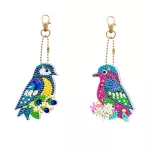 Két díszes madár mindkét oldalon kirakható gyémántszemes kirakó világító kulcstartók 